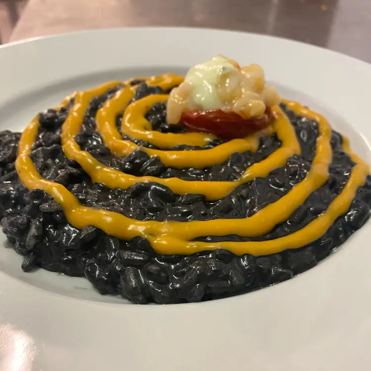 creation thumb for Cuttlefish ink rice, bisque, prawn tartare, burrata, basil