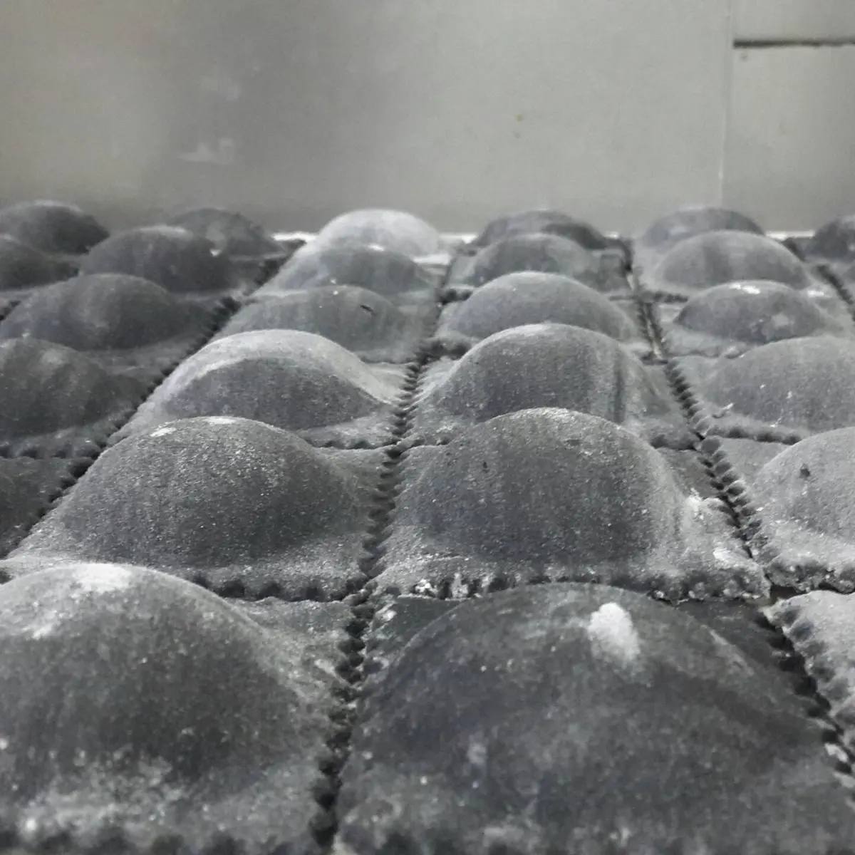 creation thumb for Salmon and raspberry ravioli with squid ink pasta