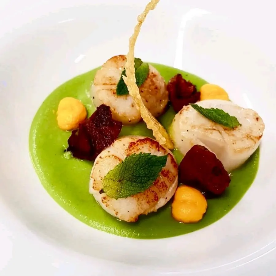 creation thumb for Pan fried scallops with pea and mint cream, crispy guanciale, carrot puree and polenta chip.