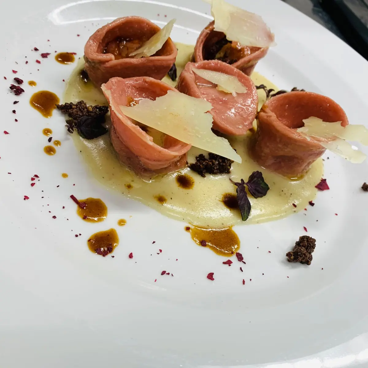 creation thumb for Red beet tortelli stuffed with braised lamb, burnt potato cream, drunken cheese and dark chocolate crumble