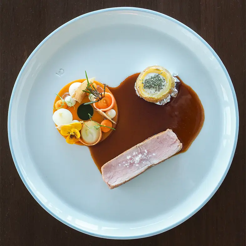 creation thumb for Saddle of veal with baked potato in silver leaf and pumpkin ring