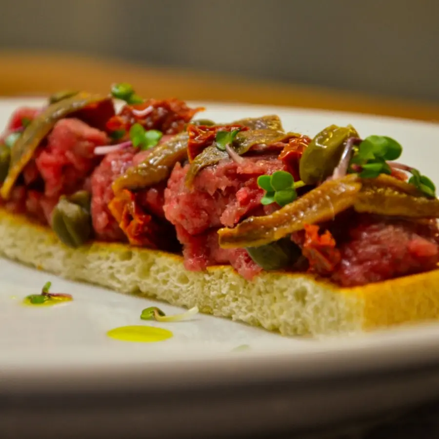 creation thumb for Beef tartare with anchovies, sun-dried tomatoes, capers, bruschetta