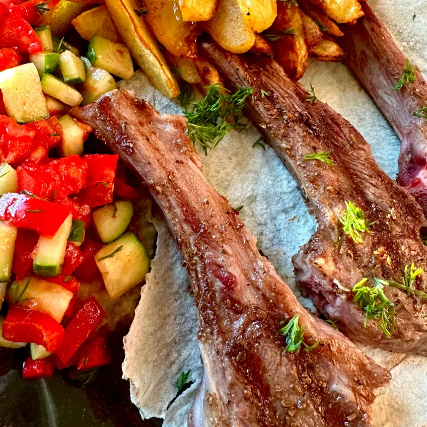 creation thumb for Spicy grilled rack of lamb with potato wedges and vegetables