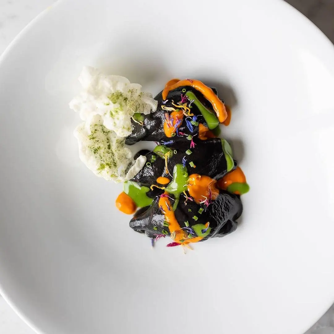 creation thumb for Calamari simmered in an Ink Sauce with crispy Rice