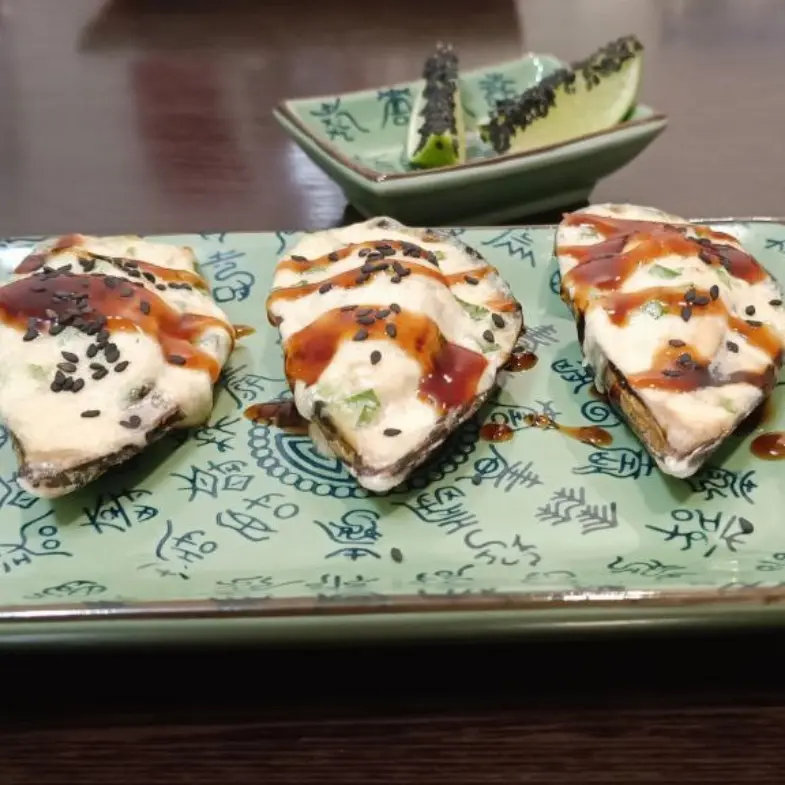 creation thumb for Baked Mussels with Black Garlic and Anchovies