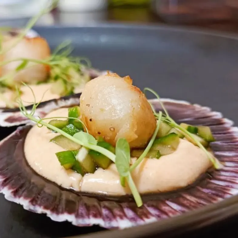creation thumb for Scallop with cucumber concasse and caviar sauce.