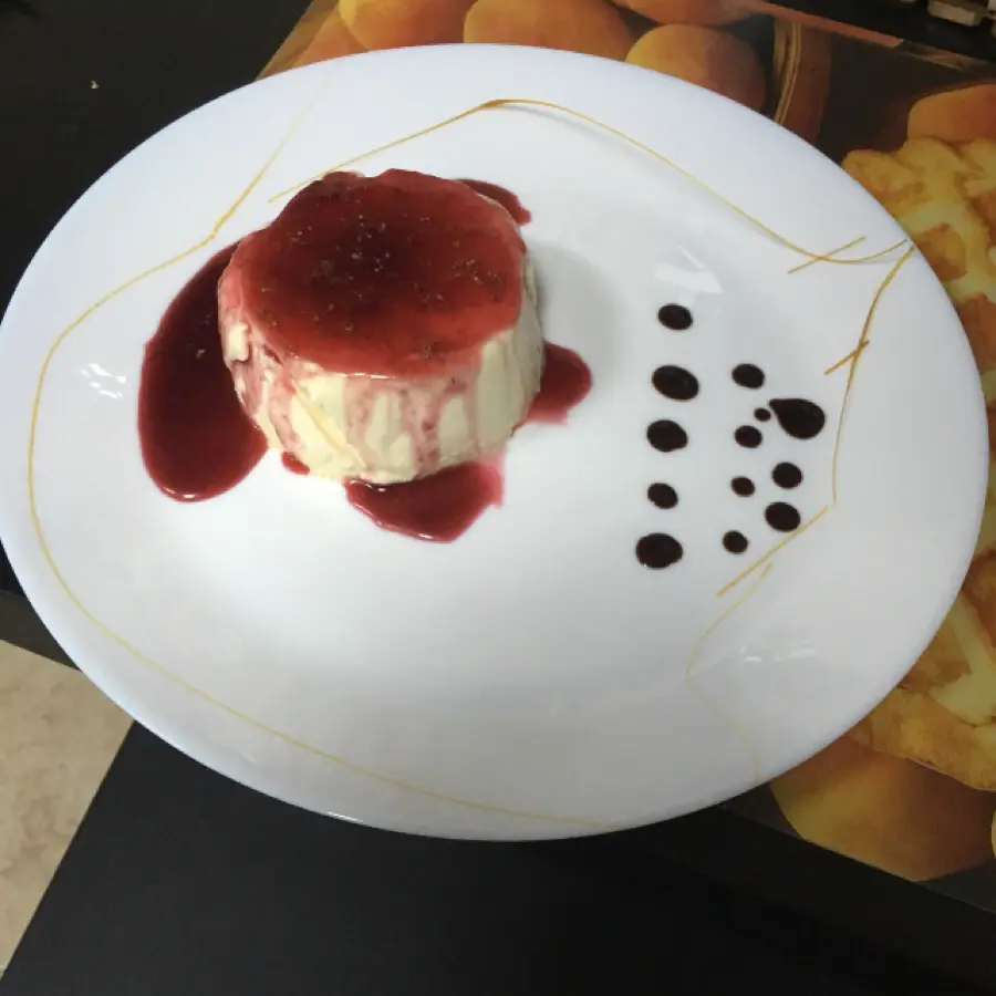 creation thumb for Vanilla Pannacotta with raspberry coulis, hazelnuts and chocolate sauce