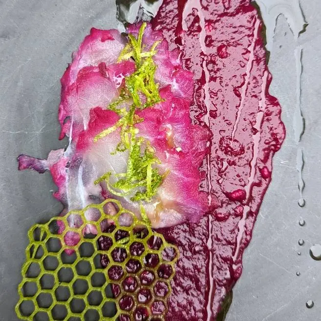 creation thumb for Ike Jime Sea Bass Carpaccio Aged in Pomegranate