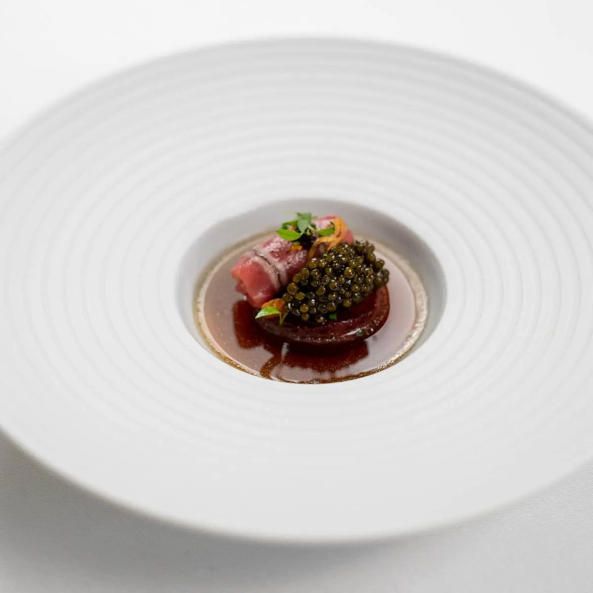 creation thumb for Braised Veal | Roasted Onions | Beef Tea | Kaviari Kristal Caviar | Persinette Cress