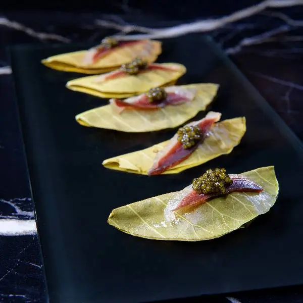 creation thumb for Smoked mackerel and cured duck with homemade galangal relish, torch ginger, madan fruit wrapped in cashew leaf
