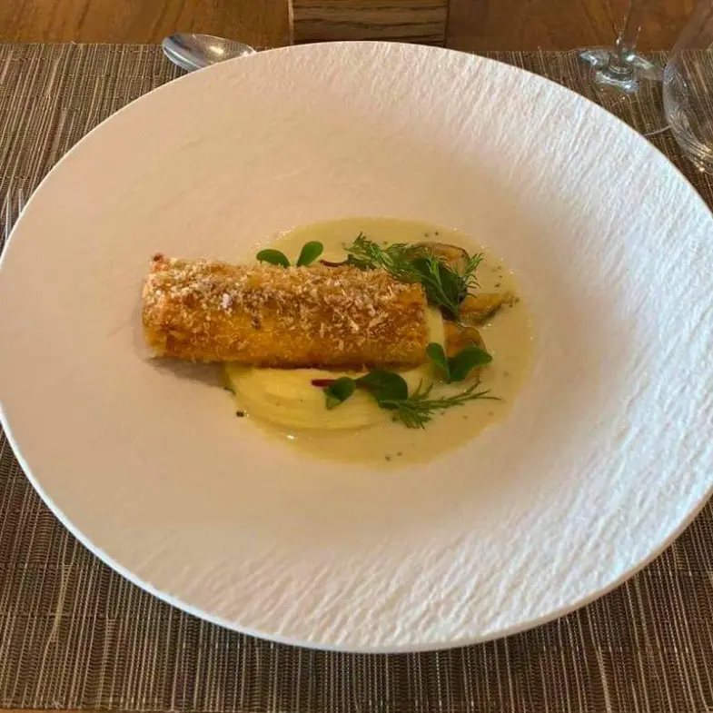 creation thumb for Sea bass roulade with potato puree and saffron/mussel sauce.