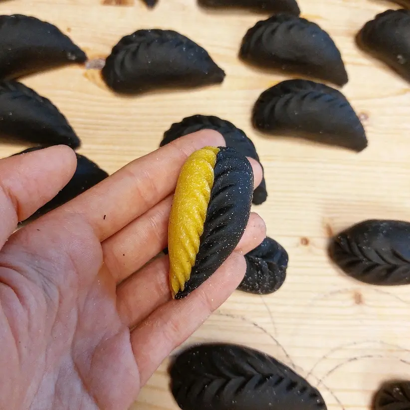 creation thumb for Bicolor culurgiones with saffron and cuttlefish ink