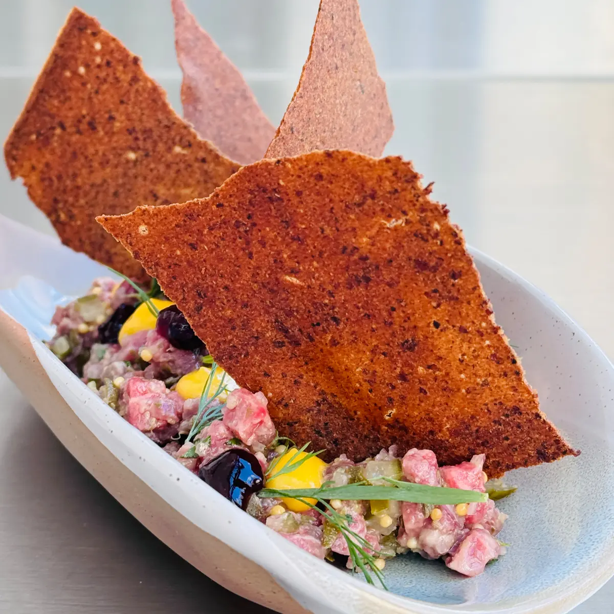 creation thumb for Dry-Aged Beef Tartare with Charcoal Dressing and Rye Cracker