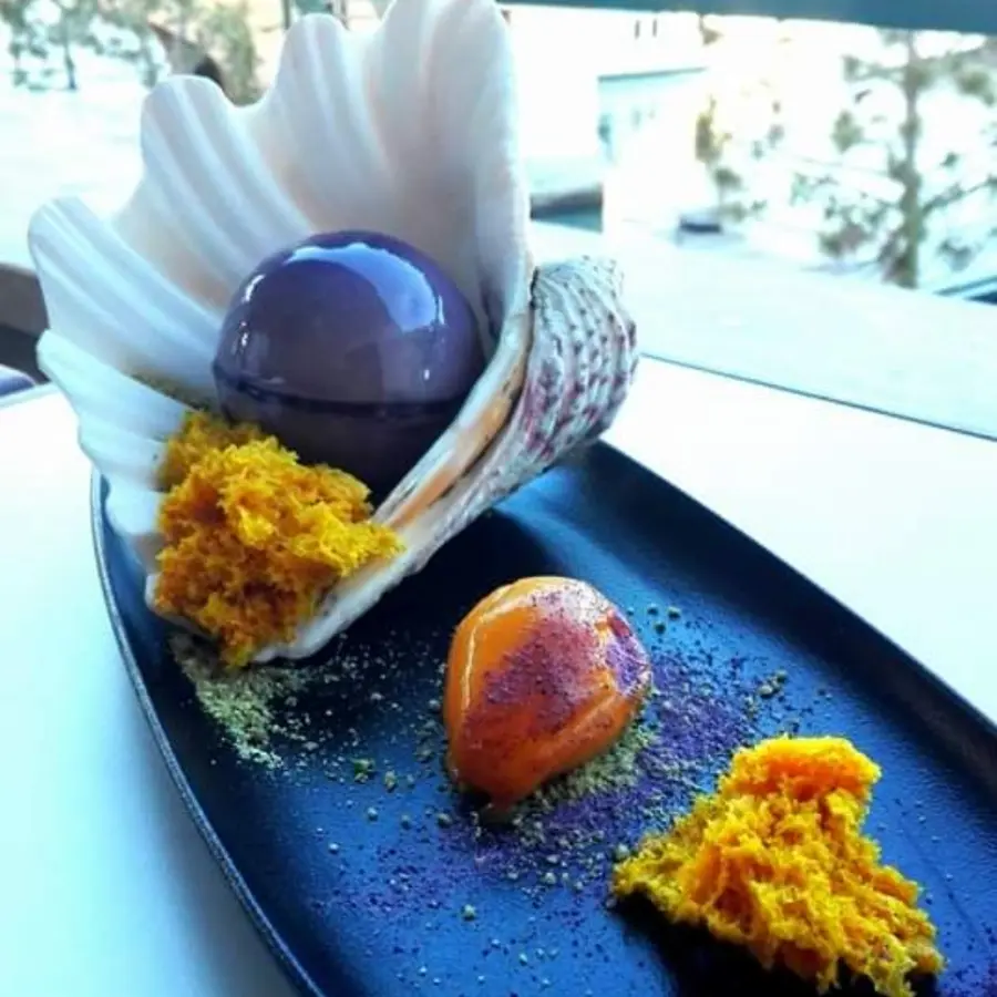 creation thumb for White chocolate mouse, mango and lemon grass sponge, mango sorbet, blueberries and pistachio powder.