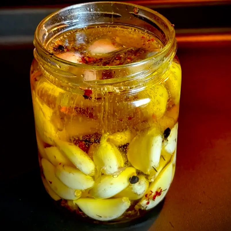 creation thumb for Slow-Roasted Garlic Confit with Rosemary and Chili 🧄🌶️🌿