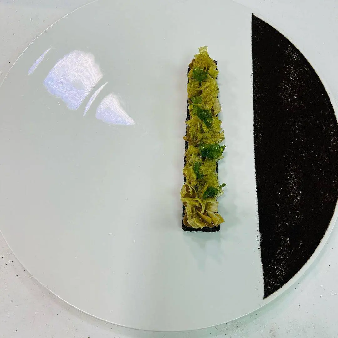 creation thumb for Grilled Leek, Sunflower Seed Praline & Parsley Coulis
