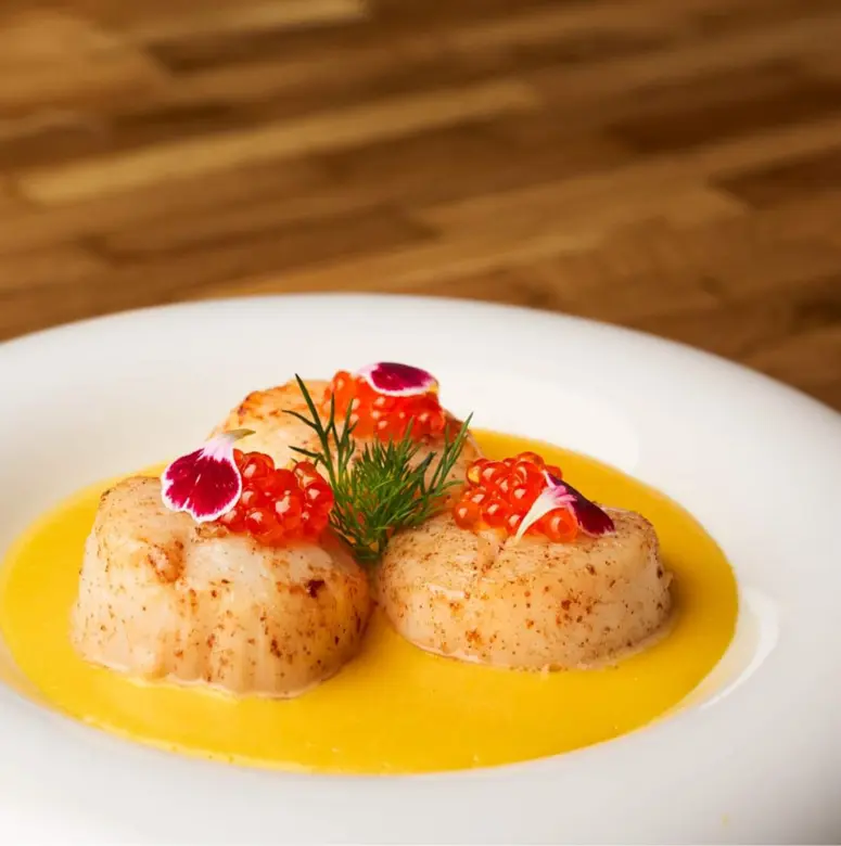creation thumb for SEARED SCALLOPS, TROUT ROE, AND SAFFRON SAUCE
