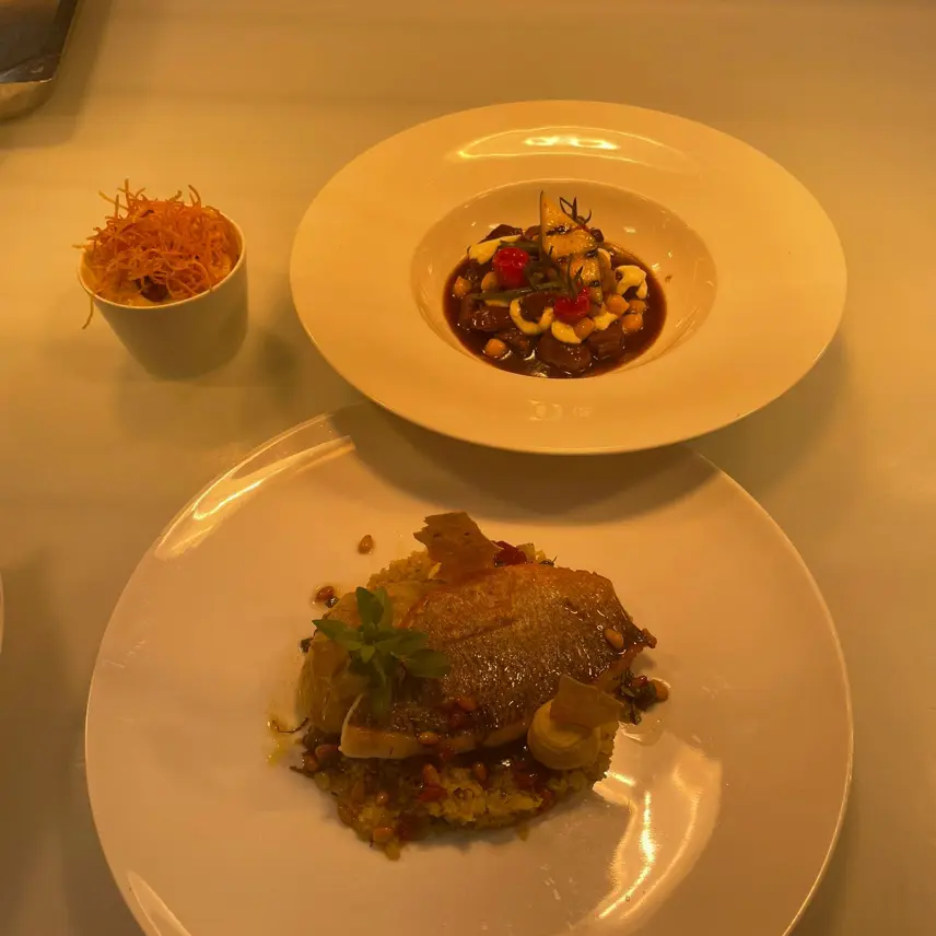creation thumb for Below: Sea bream Above: Lamb navarin with potato foam