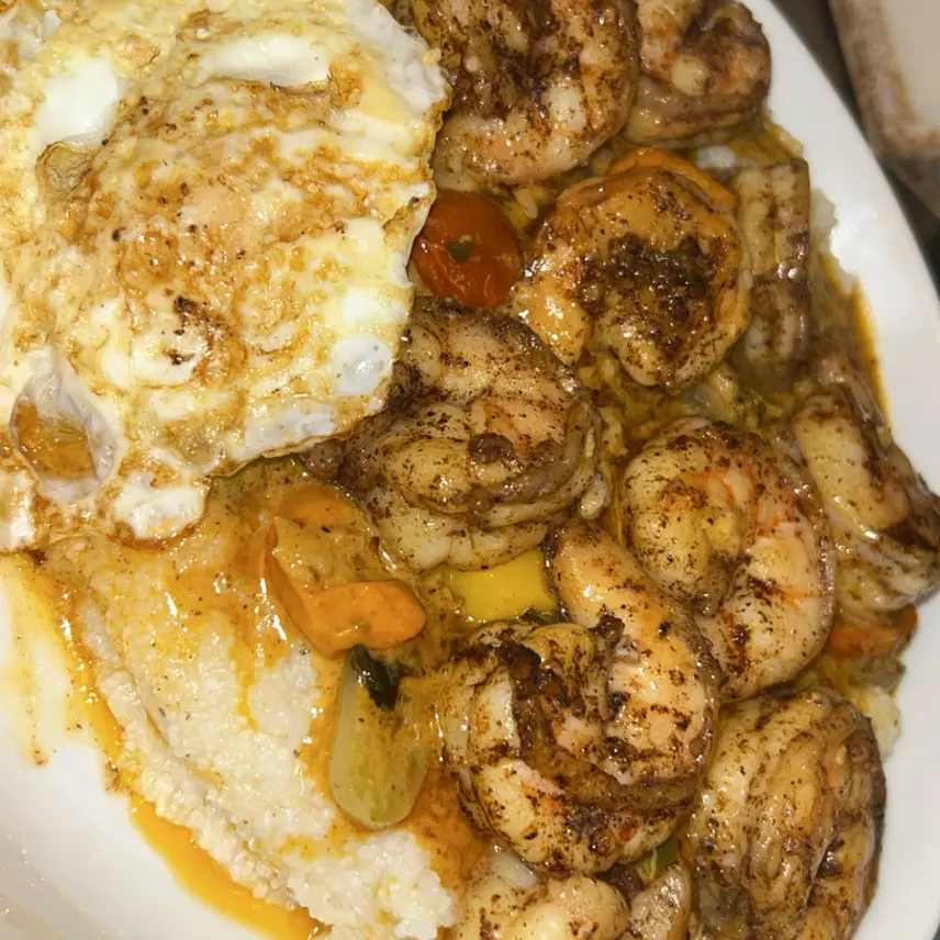 creation thumb for Shrimp & grits with Cajun sauce and egg.