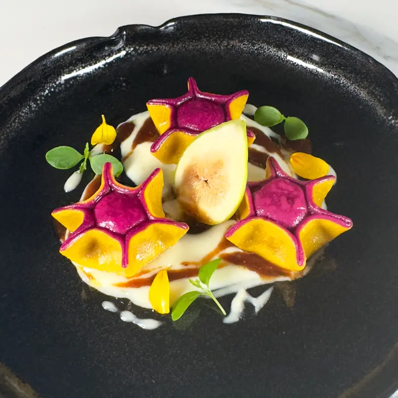 creation thumb for Two-coloured raviolo with ham, figs, pecorino cheese