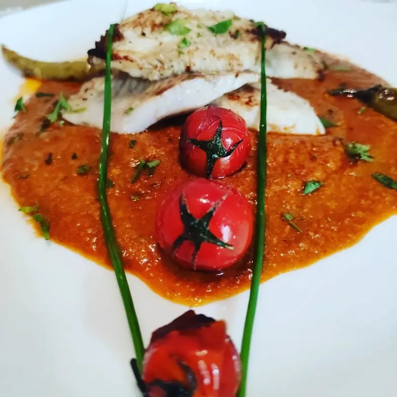 creation thumb for Seared sea bass on a bed of seafood ragout.