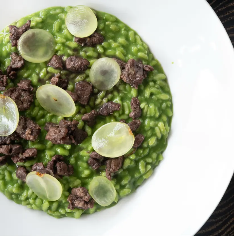 creation thumb for Risotto with Chicory Purée, Venison Ragù, and Grapes