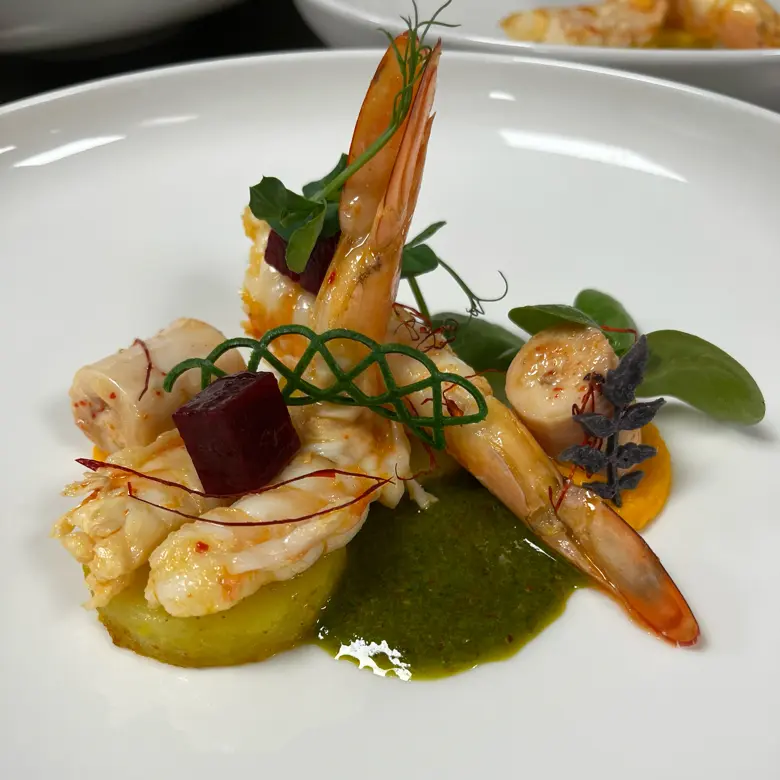 creation thumb for Confit octopus and shrimp, saffron fondan potatoes green oil