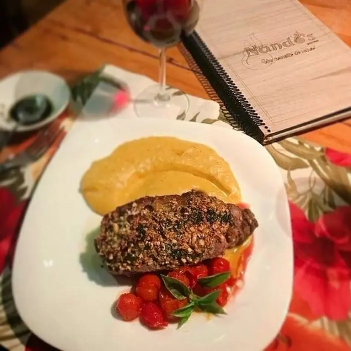 creation thumb for chorizo steak in cashew crust, ground banana puree and candied tomatoes