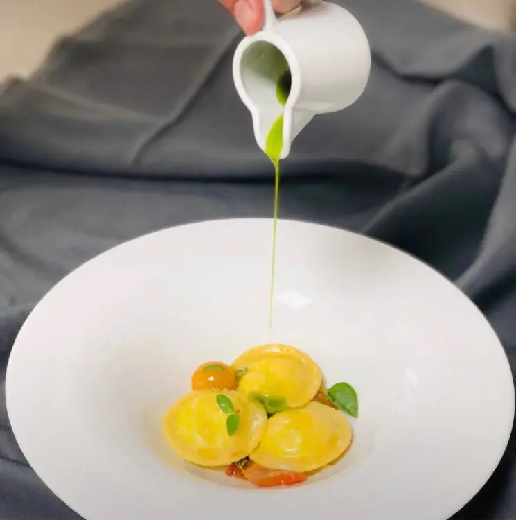 creation thumb for Ricotta and Spinach Ravioli with Basil Oil and Confit Tomato